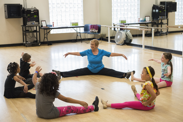 Dance instructor Lori Day, center, teaches her students, clockwise from right, Alaina Michaelson, 8, Abby Watanabe, 7, Elan Turner, 7, Imani Reed, 7, and Garrett Rehfeld, 10, how to properly stret ...