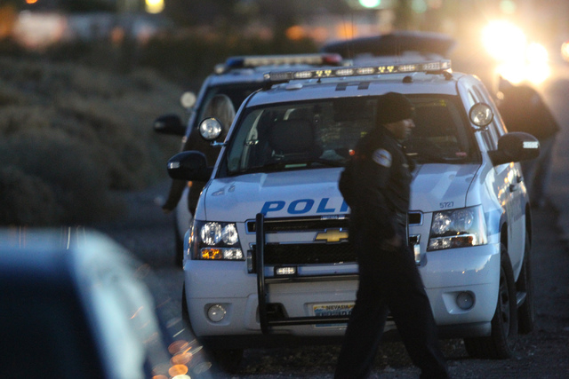 Henderson police investigate a reported body found on a drainage ditch on Wiesner Way near Aspen Peak Loop in Henderson Sunday, Dec. 14, 2014. (Erik Verduzco/Las Vegas Review-Journal)