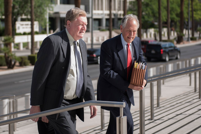 Former Las Vegas Police Capt. Frank Sutton, left, and his attorney Richard Wright walk to the Lloyd George U.S. Courthouse in Las Vegas on Thursday, May 21, 2015, where Sutton was scheduled to be  ...