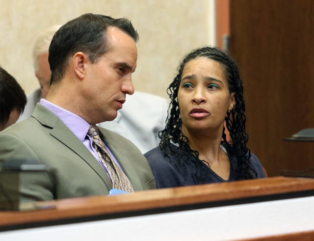 Kelli Phillips, right, appears in front of Judge Chris Lee at North Las Vegas Justice Court Thursday, May 21, 2015. Phillips faces 10 counts of child abuse or neglect. Lee issued a continuance to  ...