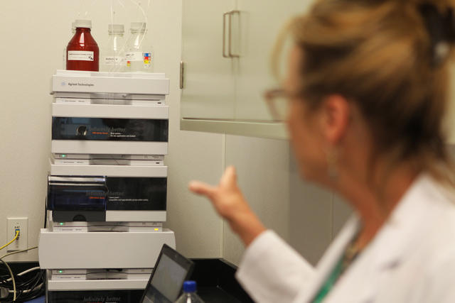 Dr. Cindy Orser, chief science officer for DigiPath Labs, shows a liquid chromatography system inside the analytical room during a tour of the DigiPath Labs facility in Las Vegas Wednesday, April  ...