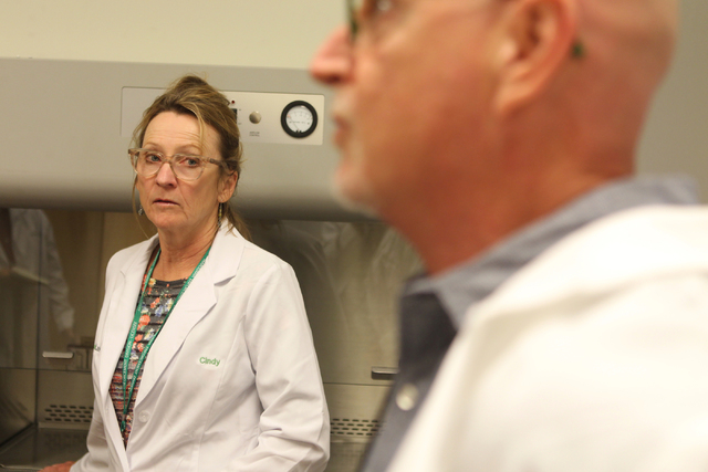 DigiPath Labs employees Dr. Cindy Orser, left, chief science officer, with CEO Todd Denkin, are interviewed during a tour of the DigiPath Labs facility in Las Vegas Wednesday, April 15, 2015. Digi ...