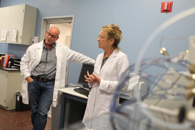 DigiPath Labs employees CEO Todd Denkin, left, with Dr. Cindy Orser, chief science officer, are interviewed during a tour of the DigiPath Labs facility in Las Vegas Wednesday, April 15, 2015. Digi ...