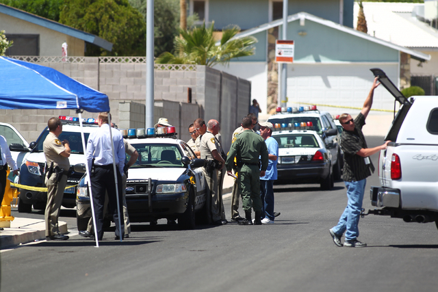 Las Vegas police investigate an officer-involved shooting on the 6300 block of Blue Jay Way, near Oakey and Jones boulevards in Las Vegas on Wednesday, April 29, 2015. Police were responding to an ...