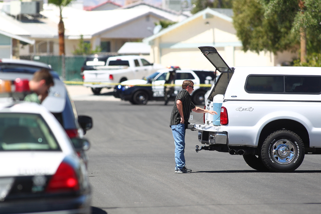 Las Vegas police investigate an officer-involved shooting on the 6300 block of Blue Jay Way, near Oakey and Jones boulevards in Las Vegas on Wednesday, April 29, 2015. Police were responding to an ...