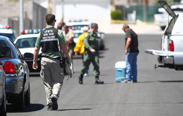 Las Vegas police investigate an officer-involved shooting on the 6300 block of Blue Jay Way, near Oakey and Jones boulevards in Las Vegas on Wednesday, April 29, 2015. Police were responding to an ...