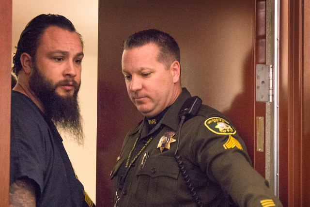 Michael Kitchen, left, the Metro detective facing several charges, makes his initial court appearance Jan. 27, 2015, in Las Vegas Justice Court. (Jeff Scheid/Las Vegas Review-Journal)