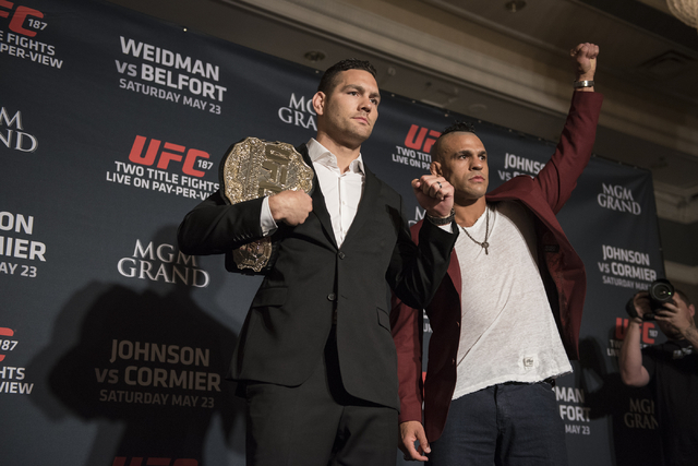 UFC middleweight champion Chris Weidman, left, and his opponent, Vitor Belfort, pose for photographs during media day before competing at UFC 187 from the MGM Grand in Las Vegas on Thursday, May 2 ...
