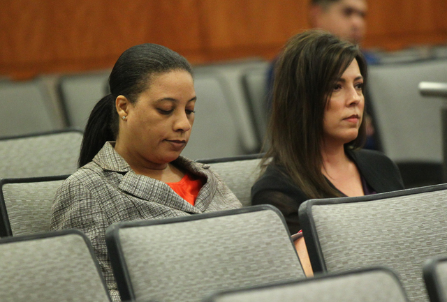 North Las Vegas human resources employee Bachera Washington, left, sits with an unidentified woman during a city council meeting where an item was passed to outsource the human resources departmen ...