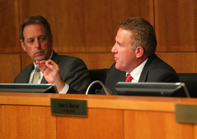 North Las Vegas Councilman Wade Wagner, right, speaks as Mayor John Lee during an agenda item about the possibility of the city outsourcing it's human resources department to a third party during  ...