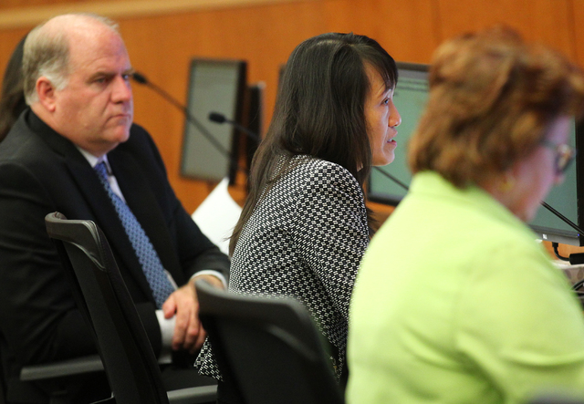 North Las Vegas City Manager Qiong Liu, center, speaks during an agenda item about the possibility of the city outsourcing its human resources department to a third party during a city council mee ...