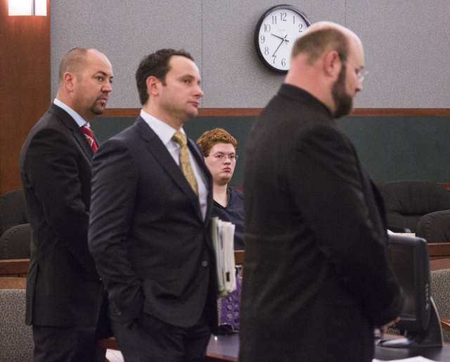 Defense attorneys Roy Nelson, left, Josh Tomsheck and Augustus Claus appear at a hearing at the Regional Justice Center on Thursday, May 21, 2014. Derrick Andrews, seen in the background, appointe ...