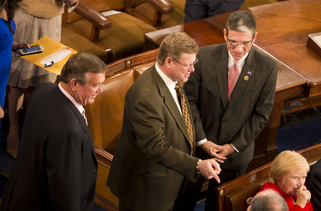 Nevada Republican Reps. Cresent Hardy, Mark Amodei and Joe Heck congregate on the U.S. House floor Tuesday awaiting the gaveling in of the 114th Congress. Photo by Lisa Helfert, special to Stephen ...