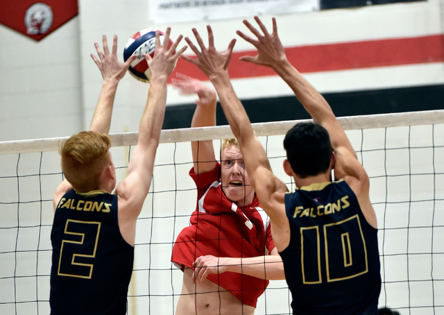 Las Vegas’s Paul Swenson, center, hits the ball against Foothill’s ...