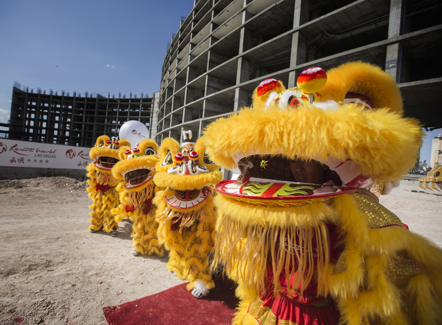 Members of the Resorts World Lion Dancers perform during the groundbreaking of the $4 billion Resorts World Las Vegas resort property, the site of the former Stardust hotel-casino on Tuesday, Ma ...