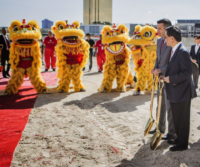 K.T. Lim, chairman,right,  and CEO of Genting Group, walks with Gov. Brian Sandoval  during the groundbreaking of  the $4 billion Resorts World Las Vegas resort property, the site of the former St ...