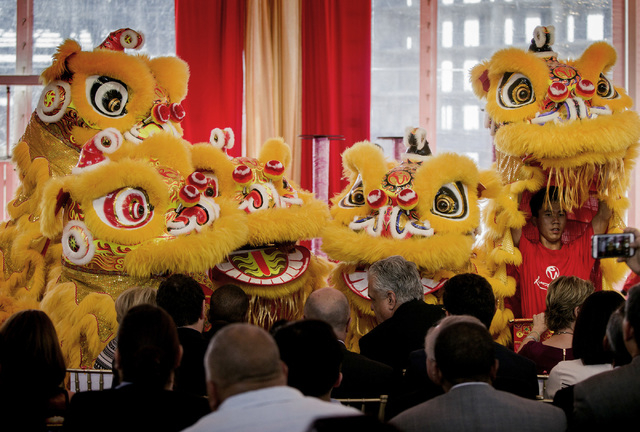 Members of the Resorts World Lion Dancers perform during the groundbreaking of the $4 billion Resorts World Las Vegas resort property, the site of the former Stardust hotel-casino on Tuesday, Ma ...