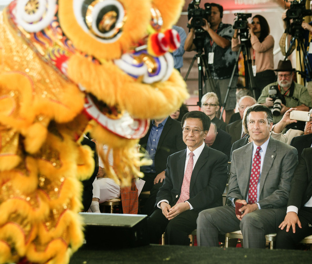 K.T. Lim, chairman,left,  and CEO of Genting Group, and Gov. Brian Sandoval watch the Resorts World Lion Dancers  during the groundbreaking of  the $4 billion Resorts World Las Vegas resort proper ...