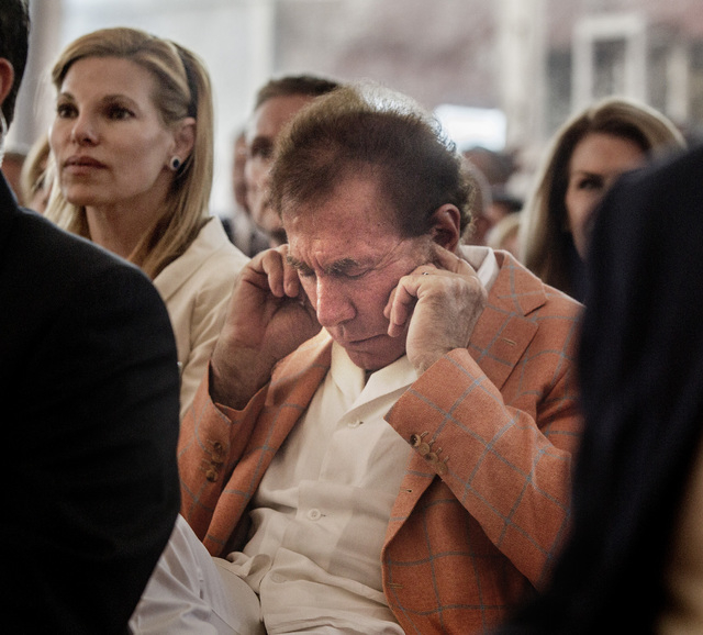 Steve Wynn, CEO of Wynn Resorts places earplugs while the  Resorts World Lion Dancers perform  during the groundbreaking of  the $4 billion Resorts World Las Vegas resort property, the site of the ...