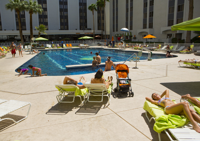 People lounge at the Riviera hotel-casino pool on Monday, April 20, 2015. The resort will close Monday, May 4, to make room for Las Vegas Convention Center expansion. (Jeff Scheid/Las Vegas Review ...