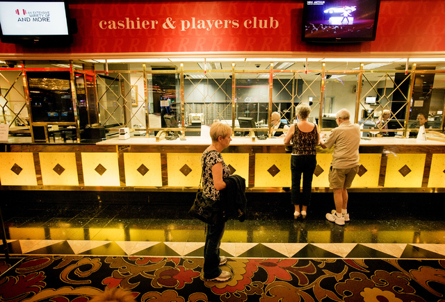 People stand at the cashier desk at the Riviera hotel-casino, 2901 Las Vegas Blvd. South, on Wednesday, April 23, 2015. The resort will close Monday, May 4, to make room for Las Vegas Convention C ...