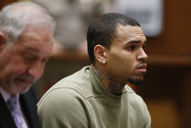 Singer Chris Brown, who pleaded guilty to assaulting his girlfriend Rihanna, appears in court with his lawyer Mark Geragos for a progress hearing, in Los Angeles, California, January 15, 2015.  (L ...
