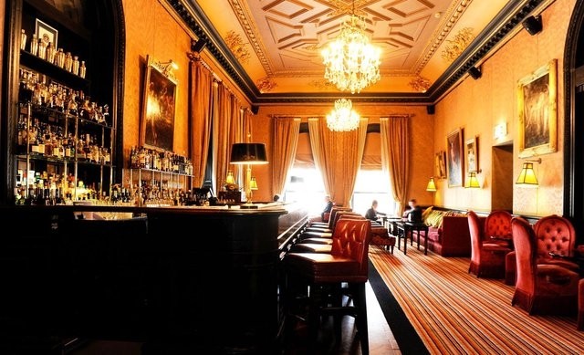 With its Baccarat chandeliers, antique fireplace, damask walls and Chesterfield armchairs, The Bar in The Merchant Hotel in Belfast is one undoubtedly classy establishment. (The Merchant Hotel/CNN)