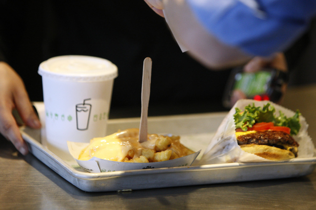 A Shake Shack burger and cheese fries are seen served at Shake Shack restaurant at New York-New York casino-hotel in Las Vegas Sunday, March 15, 2015. (Erik Verduzco/Las Vegas Review-Journal)