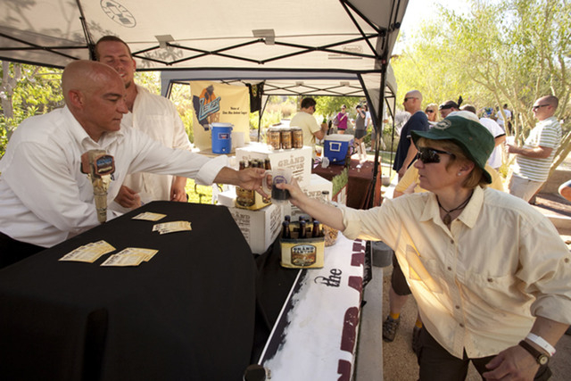 A woman receives a beer sample at a previous Brews & Blues Festival at the Springs Preserve, 333 S. Valley View Blvd. This year’s event is set 4 to 8 p.m. May 30 at the same venue. Beers from lo ...