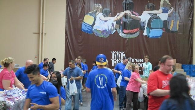 About 30 City National Bank colleagues and members of their families took part in Three Square food bank's BackPack for Kids program May 19, 2015, helping to fill 2,400 bags of food. The food will ...