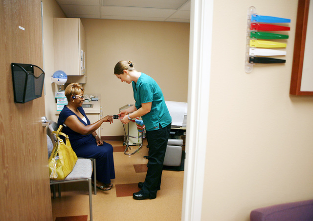 Linda Green, left, gets her vitals checked by registered nurse Meghan Bell at Volunteers in Medicine of Southern Nevada, 4770 Harrison Drive, in Las Vegas, Friday, Sept. 7, 2012. The clinic, which ...