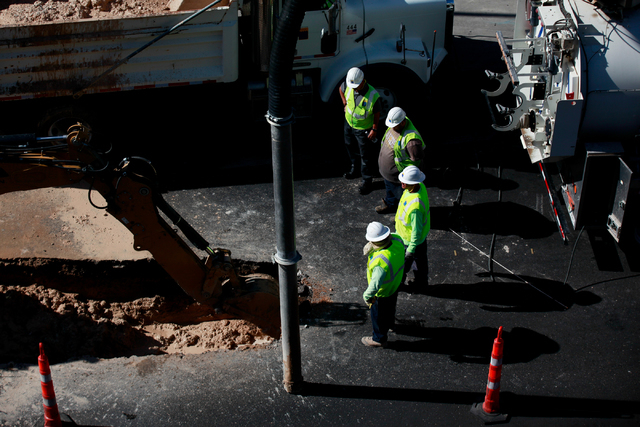 Crews work on containing a water main break on Flamingo Road outside of Bally's and The Cromwell hotel-casinos, near Las Vegas Boulevard South, on Monday morning, May 4, 2015. (Chase Stevens/Las V ...
