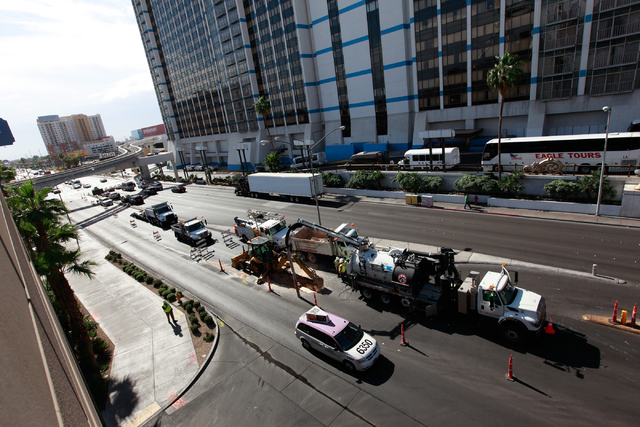 Crews work on containing a water main break on Flamingo Road outside of Bally's and The Cromwell hotel-casinos, near Las Vegas Boulevard South, on Monday morning, May 4, 2015. (Chase Stevens/Las V ...