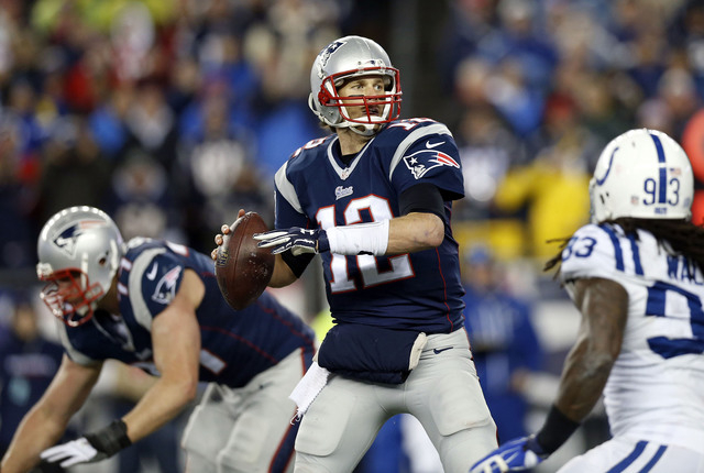 Jan 18, 2015; Foxborough, MA, USA; New England Patriots quarterback Tom Brady (12) throws a pass during the second quarter against the Indianapolis Colts in the AFC Championship Game at Gillette S ...