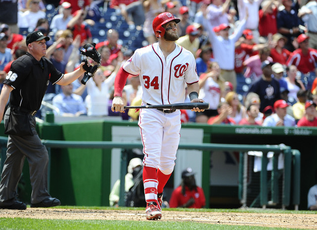 May 6, 2015; Washington, DC, USA; Washington Nationals right fielder Bryce Harper (34) watches his third home run of the day leave the park against the Miami Marlins during the fifth inning at Nat ...