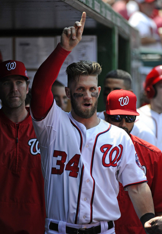 May 6, 2015; Washington, DC, USA; Washington Nationals right fielder Bryce Harper (34) celebrates in the dugout after hitting his third home run against the Miami Marlins during the fifth inning a ...