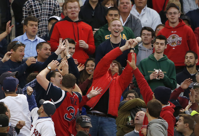 Fans at Fenway Park try to catch a foul ball during the fourth inning of the game between the Boston Red Sox and the Texas Rangers on May 20, 2015. (Winslow Townson-USA TODAY Sports)