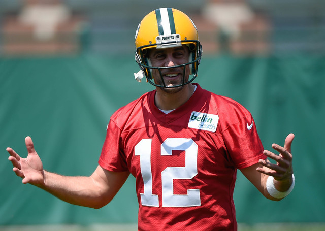 May 28, 2015; Green Bay, WI, USA; Green Bay Packers quarterback Aaron Rodgers (12) works out during Rookie Orientation Camp and Organized Team Activities at the Don Hutson Center in Green Bay. (Be ...