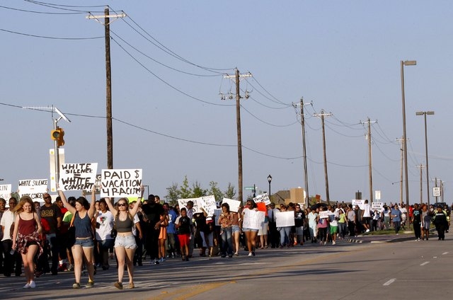 Protestors march during a rally against what demonstrators call police brutality in McKinney, Texas June 8, 2015. (REUTERS/Mike Stone)