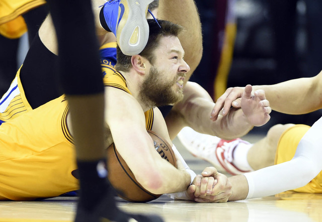 Cleveland Cavaliers guard Matthew Dellavedova (8) grabs a loose ball during the fourth quarter against the Golden State Warriors in game three of the NBA Finals at Quicken Loans Arena in Cleveland ...