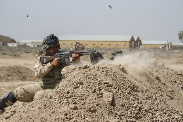 Iraqi soldiers train with members of the U.S. Army 3rd Brigade Combat Team, 82nd Airborne Division, at Camp Taji, Iraq, in this U.S. Army photo released June 2, 2015. (REUTERS/U.S. Army/Sgt. Cody  ...