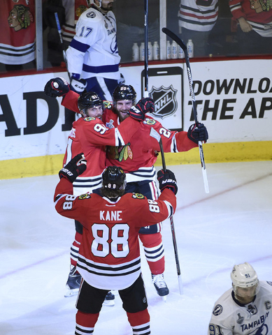 Jun 10, 2015; Chicago, IL, USA; Chicago Blackhawks left wing Brandon Saad (20) celebrates with center Brad Richards (91) and right wing Patrick Kane (88) after scoring a goal against Tampa Bay Lig ...