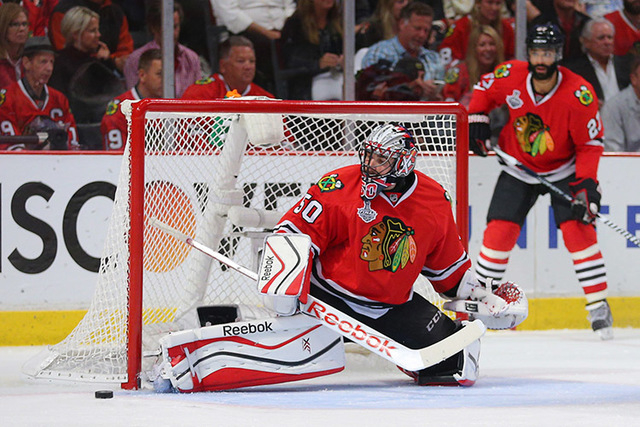 Jun 10, 2015; Chicago, IL, USA; Chicago Blackhawks goalie Corey Crawford (50) makes a save against the Tampa Bay Lightning in the third period in game four of the 2015 Stanley Cup Final at United  ...