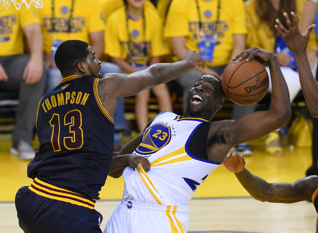 Jun 14, 2015; Oakland, CA, USA; Golden State Warriors forward Draymond Green (23) grabs a rebound against Cleveland Cavaliers center Tristan Thompson (13) in game five of the NBA Finals at Oracle  ...