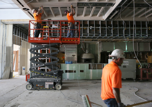 Cruz Chavarria, left, and Gerardo Guardado, center, both of Vergith Contracting, work on the construction of Salute at Red Rock hotel-casino Wednesday, June 3, 2015, in Las Vegas. The new Italian  ...