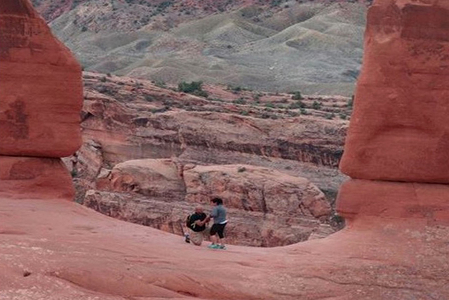 An Arkansas woman finally located the happy couple that she snapped a photo of during their marriage proposal in Arches National Park.