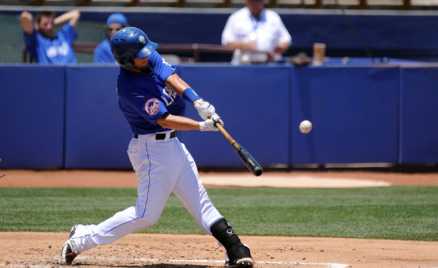 Las Vegas 51s catcher Dan Rohlfing hits a three run home run in the third inning of their Triple-A minor league baseball game against the Reno Aces at Cashman Field Sunday June 14, 2015. Las Vegas ...