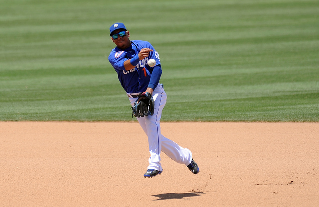 Las Vegas 51s shortstop Wifredo Tovar throws out a Reno Aces base runner at first base in the seventh inning of their Triple-A minor league baseball game at Cashman Field Sunday June 14, 2015. Las ...