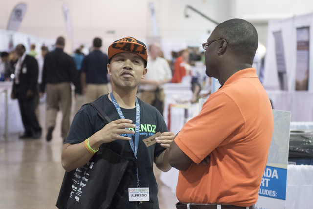 Left, Alfredo Sibucao, owner of Hot Trendz, speaks with Shaundell Newsome, founder of Sumnu Marketing, during the Las Vegas Metro Chamber Of Commerce Business Expo at Cashman Center in Las Vegas,  ...