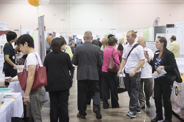 Attendees and vendors interact on the exhibition floor during the Las Vegas Metro Chamber Of Commerce Business Expo at Cashman Center in Las Vegas, Wednesday, June 10, 2015. (Jason Ogulnik/Las Veg ...